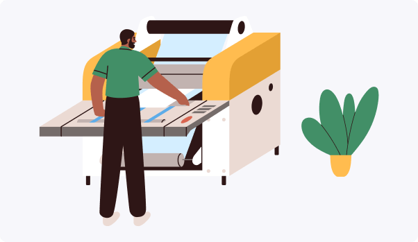 man under printing machine with a colorful large printer